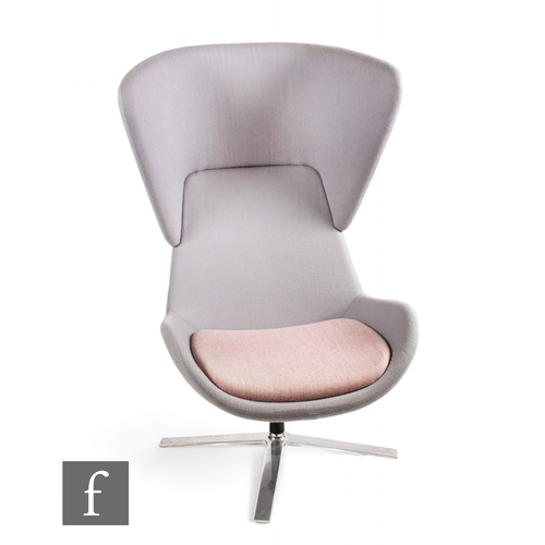 1294 - Orangebox - A soft fabric LM24 highback armchair, in light purple/grey contrasting colour, on four s... 