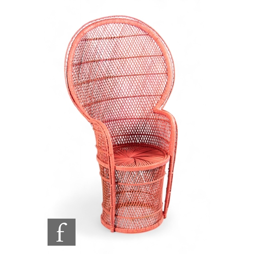 914 - Unattributed maker - A 1970s pink cane and wicker 'Peacock' chair, the fan back with woven seat and ... 