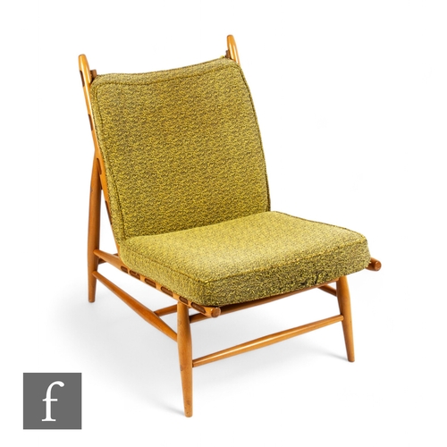 915 - Ercol - A mid Century 427 easy chair, beech frame with green fabric, height 78cm.