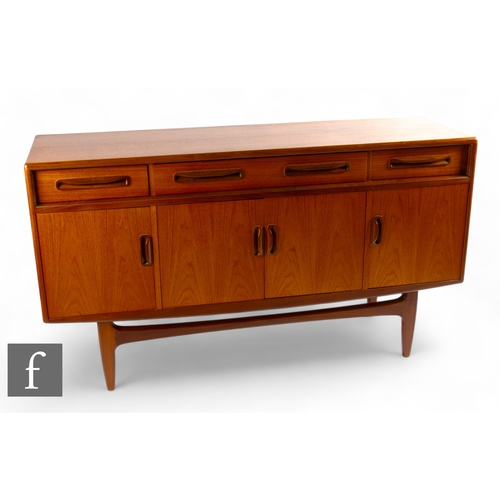 926 - G-Plan - A mid Century 'Fresco' teak sideboard, with four drawers above twin central cupboard and fu... 