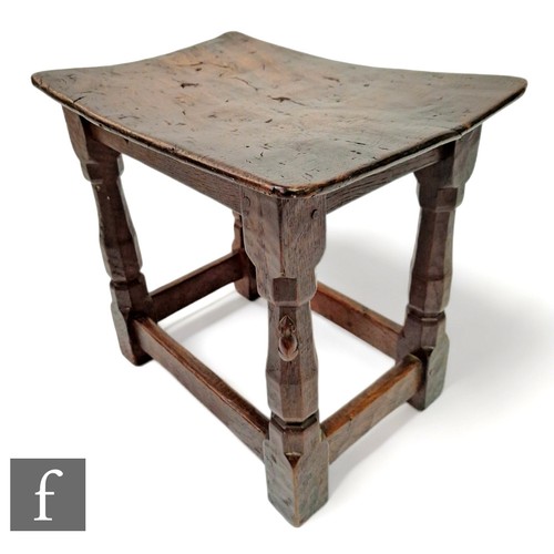 68A - Robert 'Mouseman' Thompson - Mouseman - A 1930s oak joint stool, with burr oak dished top, on carved... 