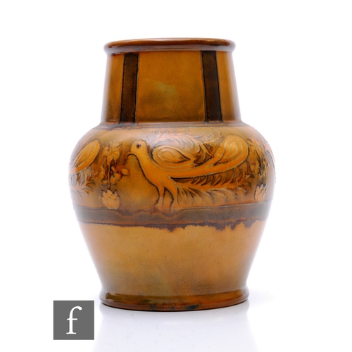 97 - William Moorcroft - A hand thrown pottery vase circa 1930, of shouldered ovoid form with a tapered c... 