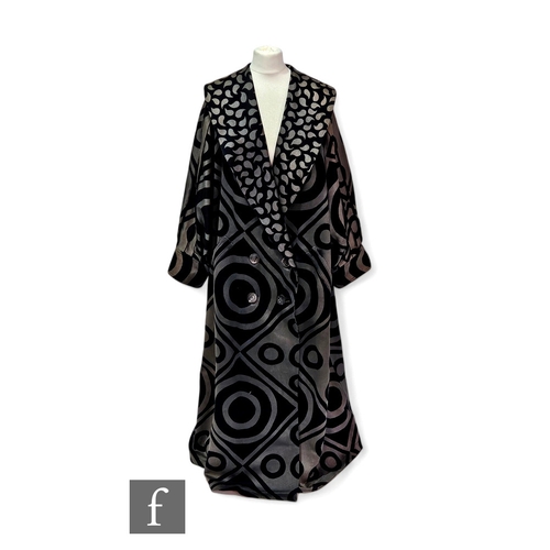 1322 - Cressida Bell - A lady's opera coat, printed in a large black geometric pattern over a heavy woven g... 