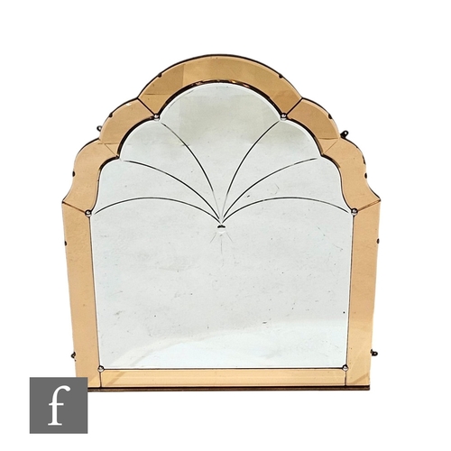 710A - Unattributed maker - An Art Deco peach scalloped edge mirror, of arched form with engraved sprays, w... 