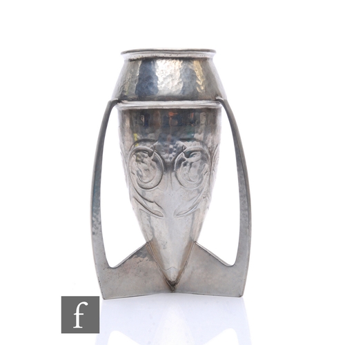 36 - Archibald Knox - Liberty & Co - An early 20th Century pewter vase of bomb form raised to three f... 