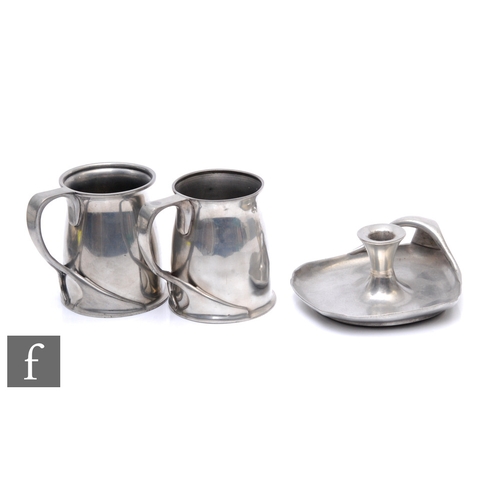 37 - Archibald Knox - Liberty & Co - A pair of pewter tankards of footed cylindrical section with whi... 