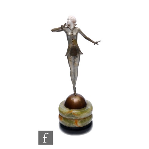 695 - Josef Lorenzl - An Art Deco bronze and ivory figure of a fashionable lady in standing pose with a hi... 