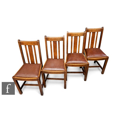 710C - Heals - A set of four 1930s Art Deco wooden dining chairs, each with slat back decoration and brown ... 