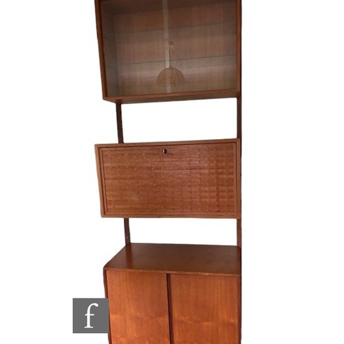 931 - Poul Cadovius - A mid Century Danish 'Royal System' teak wall unit, with upper glazed section, above... 