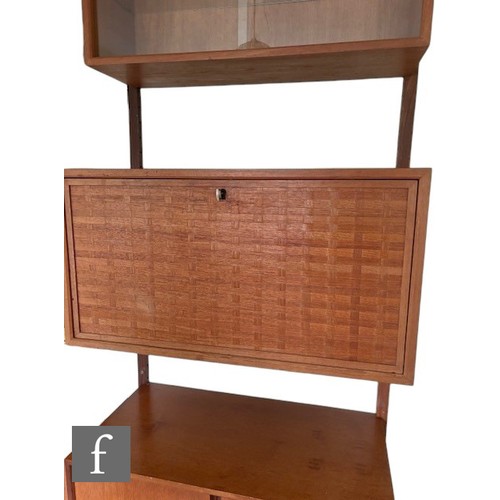 931 - Poul Cadovius - A mid Century Danish 'Royal System' teak wall unit, with upper glazed section, above... 