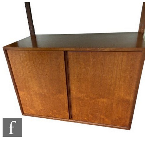 931 - Poul Cadovius - A mid Century Danish 'Royal System' teak wall unit, with upper glazed section, above... 