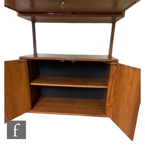 931 - Poul Cadovius - A mid Century Danish 'Royal System' teak wall unit, with upper glazed section, above... 