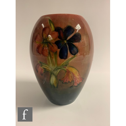 76 - Walter Moorcroft - A vase of ovoid form, flambe decorated in the Spring Flower pattern, impressed fa... 