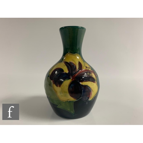 79 - Walter Moorcroft - Moorcroft - A vase of baluster form, circa 1950, tubeline decorated with flower h... 