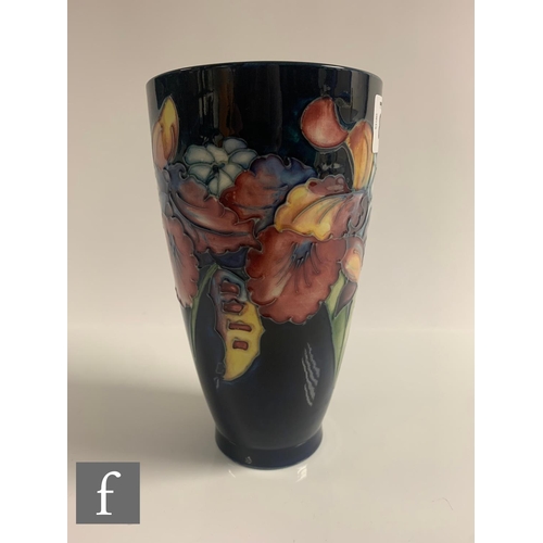 80 - Walter Moorcroft - Moorcroft - An Orchid vase of flared beaker form, tubeline decorated with stemmed... 