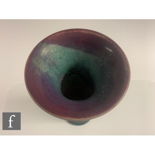 108 - Ruskin Pottery - A high fired Lily vase, of cylindrical flared form, graded deep pink to lilac with ... 