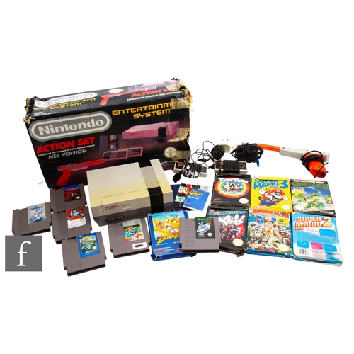 177 - A boxed Nintendo Entertainment System (NES) Action Set, together with a collection of games, some un... 