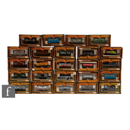 28 - A collection of OO gauge Mainline rolling stock, to include tank wagons, plank wagons, ventilated va... 