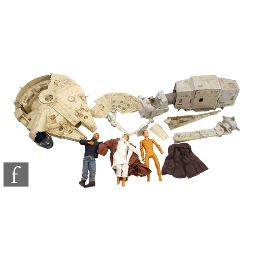 166 - Two vintage Kenner Star Wars toys, a Millennium Falcon and an AT-AT, together with a later Hasbro 12... 