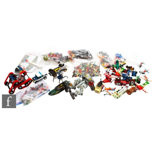 261 - A collection of assorted Lego pieces, some sets with instructions including Lord of the Rings 9471 e... 