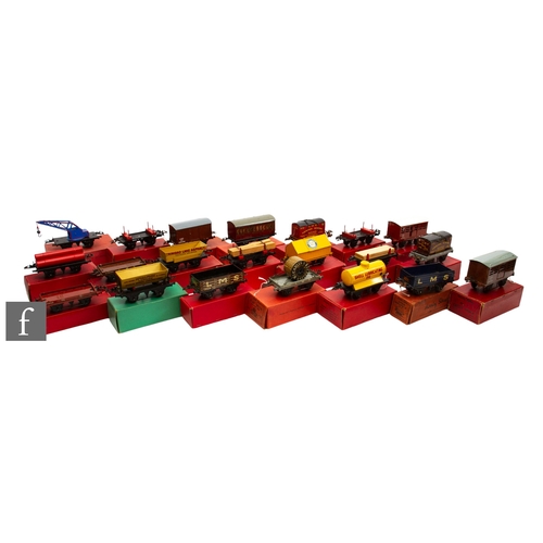 38 - A collection of O gauge Hornby passenger coaches and rolling stock, to include lumber wagons, flat t... 