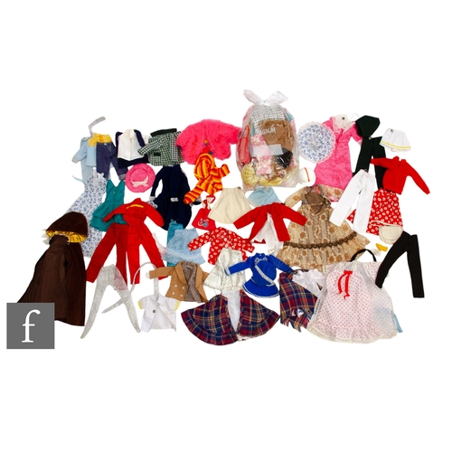 301 - A collection of Pedigree Sindy outfits, to include Premiere Girl cape and dress, Majorette dress and... 