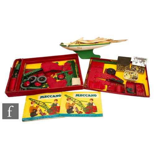 268 - A collection of Meccano pieces in a partial box, with instruction for Outfit 6 and Outfit 7/8, toget... 