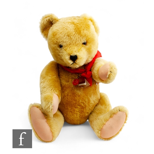 308 - A large Hermann golden mohair bear with hump and growl, jointed limbs, amber and black eyes, vertica... 