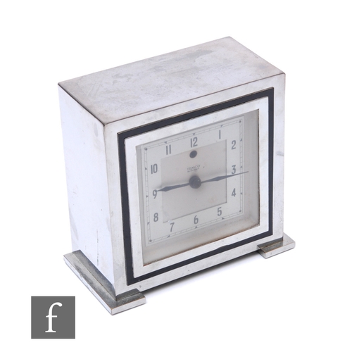 680 - Temco Electric - An Art Deco chrome table clock, of square form raised on pad feet, the silvered dia... 