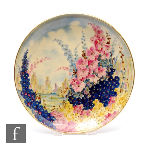 649 - Grimwades Royal Winton - An Art Deco hand painted charger, circa 1935, in the Hollyhocks pattern, di... 