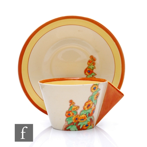 553 - Clarice Cliff - Sunshine - A conical tea cup and saucer circa 1932, transfer printed and painted wit... 