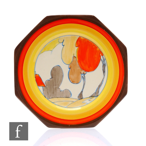 282 - Clarice Cliff - Orange Autumn - A large octagonal plate circa 1933, hand painted with a stylised tre... 