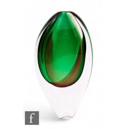 1176 - Nikki Williams - A contemporary studio glass vase of compressed ovoid form, the green core with an o... 