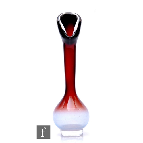 1076 - Nils Landberg - Orrefors - A mid Century 'Tan-Si' glass bulb vase, of compressed ovoid form on circu... 