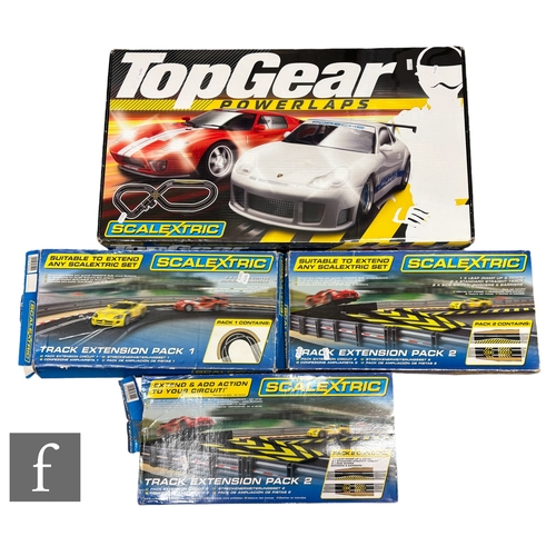 71 - A Scalextric C1218 Top Gear Power Laps set, together with three extension packs, all boxed. (4)