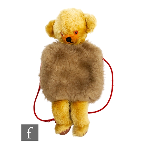 310 - A Merrythought Cheeky Bear vintage muff, golden mohair, with beige plush muff, amber and black plast... 