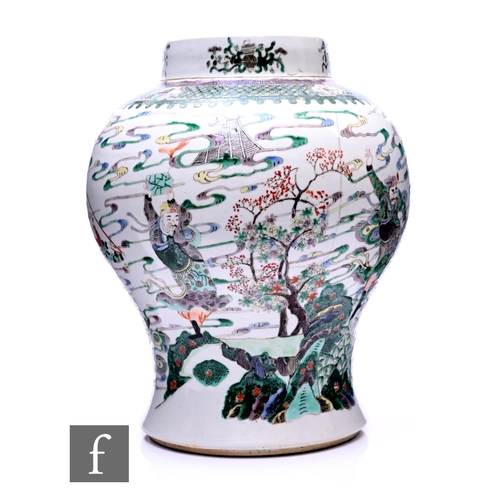 459 - A Chinese Kangxi (1662-1722) famille verte baluster vase, the pale white ground with immortal gods a... 