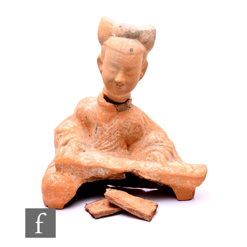 475 - A Chinese Han Dynasty (206BC-AD220) or later pottery funerary tomb guardian figure, modelled in seat... 