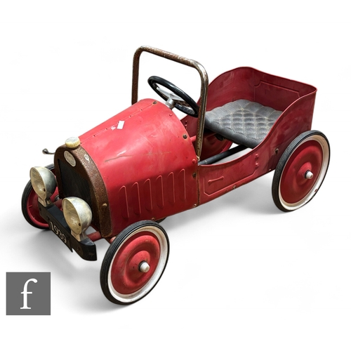 274 - A Baghera pedal car in red with white band wheels, black plastic seat, black mesh grill, Baghera emb... 