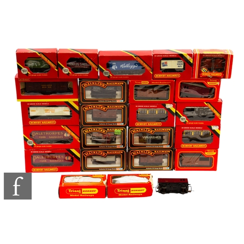 4 - A collection of OO gauge rolling stock by Hornby, Triang, and Mainline, boxed. (24)