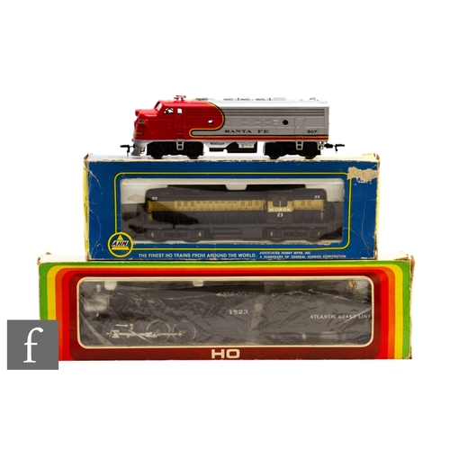 67 - Two boxed HO gauge locomotives, AHM 5131 Monon 23 RS-2 locomotive and Mehanotehnika Izola 4-6-2 Atla... 