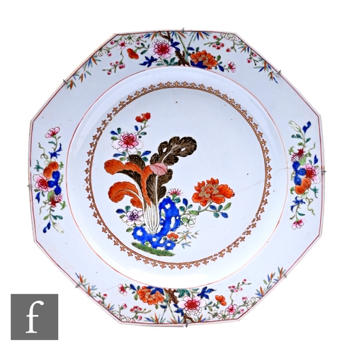 481 - A Chinese Qianlong Period (1736-1795) octagonal porcelain charger, decorated with famille rose flora... 