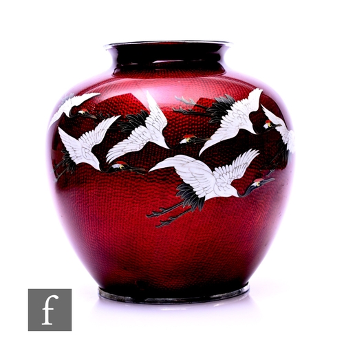 487 - A Japanese ginbari enamel cloisonne vase, the red foil ground with seven crane in flight, height 20c... 