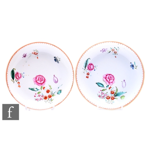 491 - A pair of 18th Century Chinese export porcelain saucer dishes, each decorated with famille rose enam... 