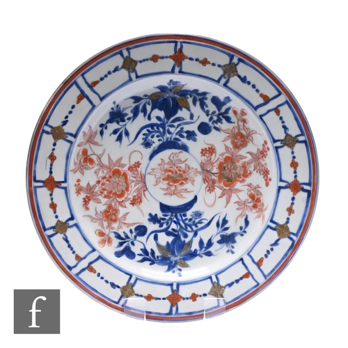 515 - An 18th Century Chinese Imari charger, blue and white ground, with gilt and iron-red enamels depicti... 