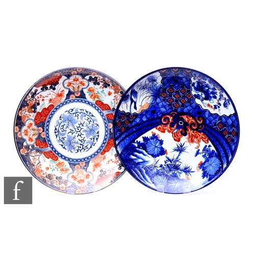 517 - Two late Meiji period Japanese Imari chargers, each similarly decorated with floral designs, diamete... 