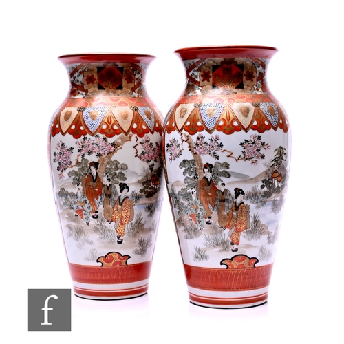 538 - A pair of early 20th Century Japanese Kutani vases, each of slender ovoid form, rising to a flared r... 