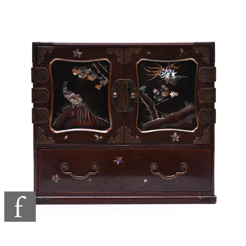 539 - An early 20th Century Japanese lacquered desk top cabinet decorated with mother of pearl highlights,... 