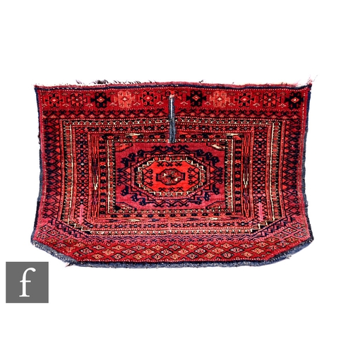 549 - A 19th Century Turkmen Saryk saddle cover, with geometric borders and designs and central split, 44c... 