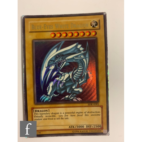 244 - A collection of assorted trading cards, to include Pokemon and Magic the Gathering, in a folder, tog... 